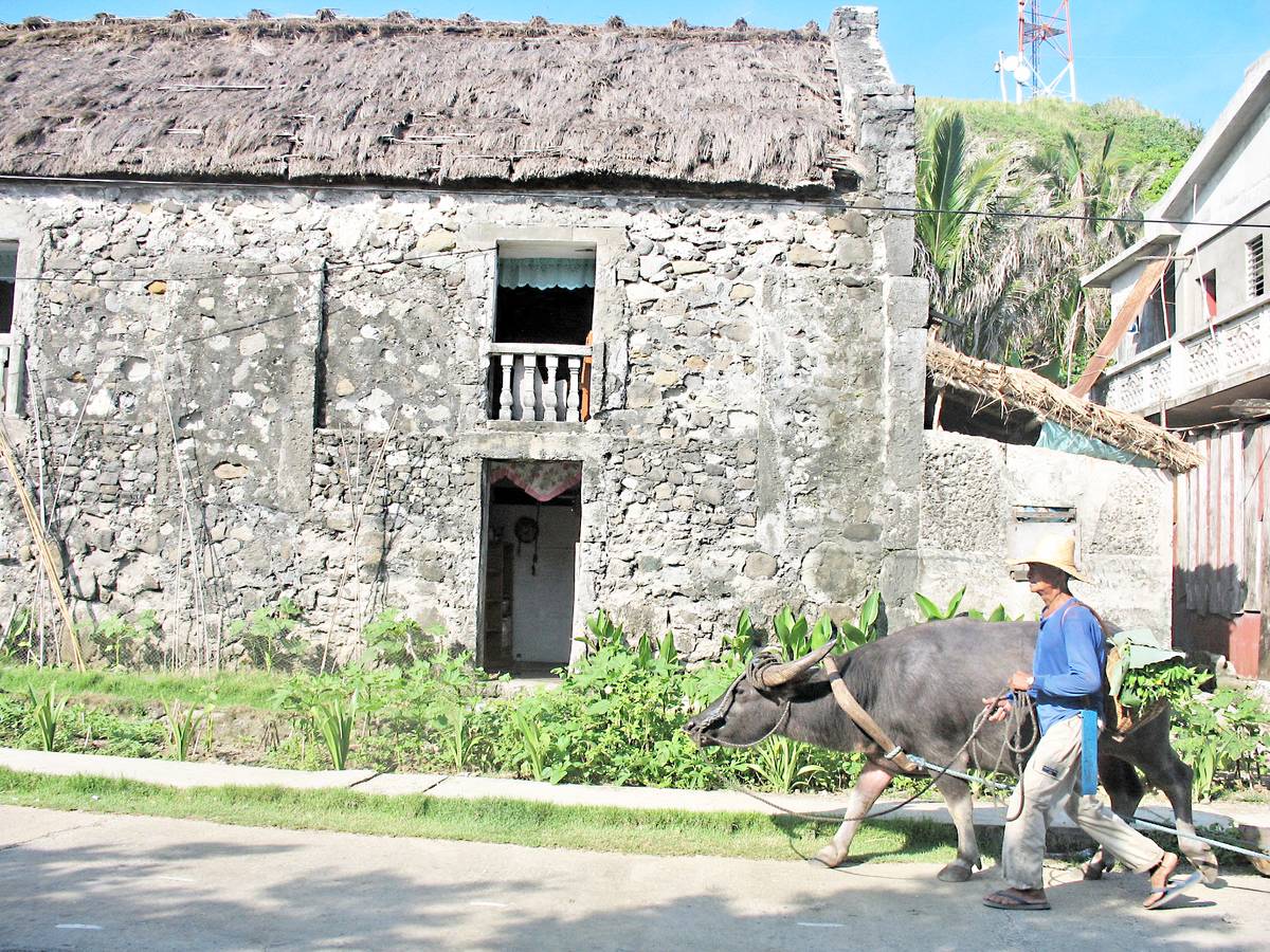 House and farmer in Sinakan, Sabtang.